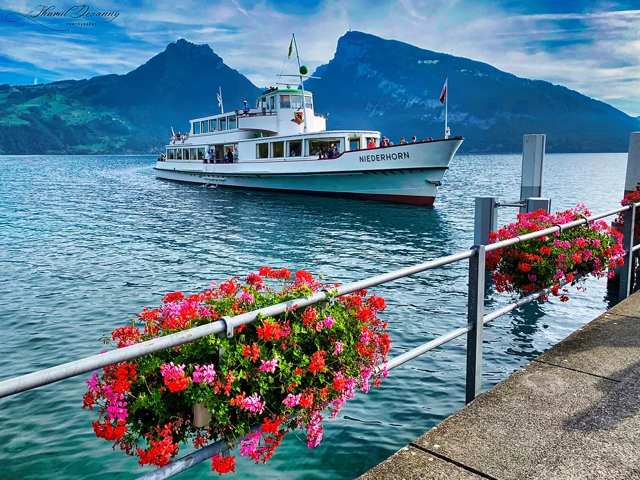 Niederhorn: Soaring above the clouds with panoramic views of the Swiss Alps and serene Lake Thun below!